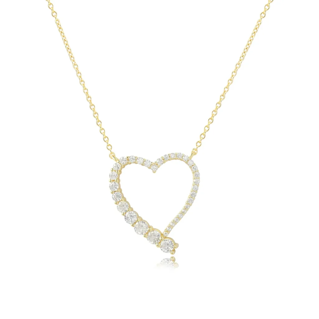 שרשרת עם תליון בצורת לב, מעוטרת באבני חן נוצצות, מתאימה לתכשיטים בסיטונאות.